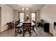 Dining room featuring a modern table, neutral tones, and ample natural light through windows at 2137 Post Grove Rd, Snellville, GA 30078