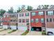Charming multi-level townhomes showcasing diverse brick and siding exteriors with private garages at 2137 Post Grove Rd, Snellville, GA 30078