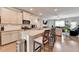 Open kitchen with granite countertops, island seating, and views of the living area at 2137 Post Grove Rd, Snellville, GA 30078