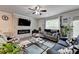 Bright living room featuring a fireplace, neutral tones, and comfortable furnishings at 2137 Post Grove Rd, Snellville, GA 30078