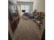 Bright office features a desk, shelving, and natural light from a large window at 2137 Post Grove Rd, Snellville, GA 30078