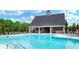 Community pool area with ample lounge chairs, perfect for relaxing and enjoying the summer at 2137 Post Grove Rd, Snellville, GA 30078