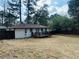 Spacious backyard featuring a new deck, fence and large trees at 2745 Marco Nw Dr, Atlanta, GA 30318