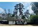 Spacious backyard featuring a new deck, fence and large trees at 2745 Marco Nw Dr, Atlanta, GA 30318