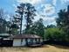Spacious backyard featuring a new deck, fence and large trees at 2745 Marco Nw Dr, Atlanta, GA 30318