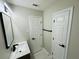 Bright bathroom featuring a white marble vanity top and modern fixtures at 2745 Marco Nw Dr, Atlanta, GA 30318