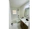 Contemporary bathroom features stylish vanity, modern fixtures, tiled shower and marble floors at 2745 Marco Nw Dr, Atlanta, GA 30318