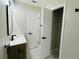 Bright bathroom featuring a white marble vanity top and open closet at 2745 Marco Nw Dr, Atlanta, GA 30318