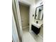 Modern bathroom with sleek black fixtures, including a mirror and floating vanity, alongside laundry hook-ups at 2745 Marco Nw Dr, Atlanta, GA 30318