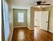 Bedroom featuring hardwood floors, a ceiling fan, and natural light from a window with blinds at 2745 Marco Nw Dr, Atlanta, GA 30318