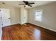 Bedroom showcasing hardwood floors, a ceiling fan, and two doors, one to the hall, one to a closet at 2745 Marco Nw Dr, Atlanta, GA 30318
