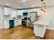 Bright and airy kitchen featuring granite countertops, white cabinets, and modern appliances at 2745 Marco Nw Dr, Atlanta, GA 30318