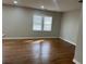 Bright living room featuring hardwood floors and large window at 2745 Marco Nw Dr, Atlanta, GA 30318