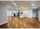 Open-concept kitchen and living room with hardwood floors and stainless steel appliances at 2745 Marco Nw Dr, Atlanta, GA 30318