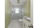 Well-maintained bathroom with marble tiled shower and granite countertop at 1108 Sw Welch Sw St, Atlanta, GA 30310
