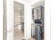 Bathroom view showcasing the tiled shower, vanity, and a stacked washer and dryer unit at 1108 Sw Welch Sw St, Atlanta, GA 30310