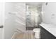 Beautiful bathroom featuring a tiled shower with glass doors, a modern vanity and marble-look tile accents at 1108 Sw Welch Sw St, Atlanta, GA 30310