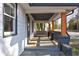 Inviting front porch features wood pillars, a cozy bench, and offers a relaxing outdoor space at 1108 Sw Welch Sw St, Atlanta, GA 30310