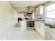 Spacious kitchen with bright backsplash and stainless appliances opens to the living room at 1108 Sw Welch Sw St, Atlanta, GA 30310