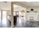 Open-concept living room with a fireplace and hardwood floors that create an inviting atmosphere at 1108 Sw Welch Sw St, Atlanta, GA 30310