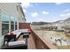 Outdoor deck with a comfortable seating area and views of the landscaped backyard and community green space at 1336 Rosen Rd, Brookhaven, GA 30319