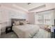 Light-filled bedroom with a comfortable bed, a window with natural light, and decor creating a serene atmosphere at 1336 Rosen Rd, Brookhaven, GA 30319