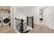 Bright hallway with laundry closet and access to a bedroom, showcasing hardwood floors and neutral wall colors at 1336 Rosen Rd, Brookhaven, GA 30319
