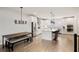 Bright kitchen boasts modern appliances, an island with seating, and a breakfast nook with a rustic table and chairs at 1336 Rosen Rd, Brookhaven, GA 30319