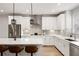 Beautiful kitchen featuring stainless steel appliances, quartz countertops, an island with bar seating, and wooden floors at 1336 Rosen Rd, Brookhaven, GA 30319