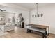 Open-concept living area with hardwood floors, modern lighting, and seamless flow into the dining area at 1336 Rosen Rd, Brookhaven, GA 30319