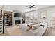 Cozy living room features a fireplace with TV, stylish shelving, and a comfortable sectional sofa with natural light at 1336 Rosen Rd, Brookhaven, GA 30319