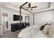 Another view of the main bedroom with a four-poster bed, tv, and view into the hallway at 1336 Rosen Rd, Brookhaven, GA 30319