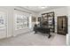 Bright office with a large window, dark wooden shelving and luxury vinyl plank flooring at 1336 Rosen Rd, Brookhaven, GA 30319