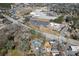 Wide aerial view of the property near athletic fields, schools, and commercial buildings at 1444 Norman Berry Dr, East Point, GA 30344