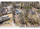 Aerial view of the property surrounded by neighborhood houses and mature trees at 1444 Norman Berry Dr, East Point, GA 30344