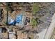 Aerial view of neighborhood houses covered in blue tarps in disrepair at 1444 Norman Berry Dr, East Point, GA 30344