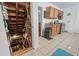 View into unfinished basement and simple kitchen with wood cabinets and stainless steel appliances at 1444 Norman Berry Dr, East Point, GA 30344