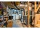 Unfinished basement with storage shelving, washer and dryer, and updated HVAC system at 1444 Norman Berry Dr, East Point, GA 30344
