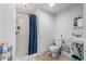 A functional bathroom with a shower, toilet, and sink offers essential amenities in a compact space at 1444 Norman Berry Dr, East Point, GA 30344