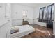 Bedroom with hardwood flooring offers natural light and a simple layout, ready for your personal touch at 1444 Norman Berry Dr, East Point, GA 30344