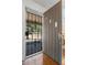 View of the front door with a decorative security gate and hardwood floors at 1444 Norman Berry Dr, East Point, GA 30344