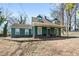 Charming two-story home with a covered front porch and traditional architectural details at 1444 Norman Berry Dr, East Point, GA 30344
