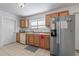 Traditional kitchen equipped with stainless steel appliances and wood cabinets at 1444 Norman Berry Dr, East Point, GA 30344