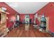 Living room featuring hardwood floors, a decorative fireplace, and access to the kitchen at 1444 Norman Berry Dr, East Point, GA 30344
