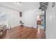 Sitting room with hardwood floors and a view into the kitchen at 1444 Norman Berry Dr, East Point, GA 30344
