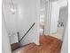 The wooden stairway offers access to the second level, with a bathroom visible near the top at 1444 Norman Berry Dr, East Point, GA 30344
