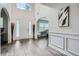 Inviting foyer with modern wood-look floors, archways, and bright natural light at 117 Kiara Ln, Stockbridge, GA 30281