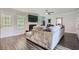 Cozy living room with a fireplace, large windows, hardwood floors, and comfortable seating at 117 Kiara Ln, Stockbridge, GA 30281