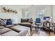 Comfortable Gathering room features sectional sofa and adjacent desk with home office setup at 117 Kiara Ln, Stockbridge, GA 30281