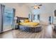 Spacious bedroom with hardwood floors, vaulted ceiling, natural light and a round bed at 117 Kiara Ln, Stockbridge, GA 30281